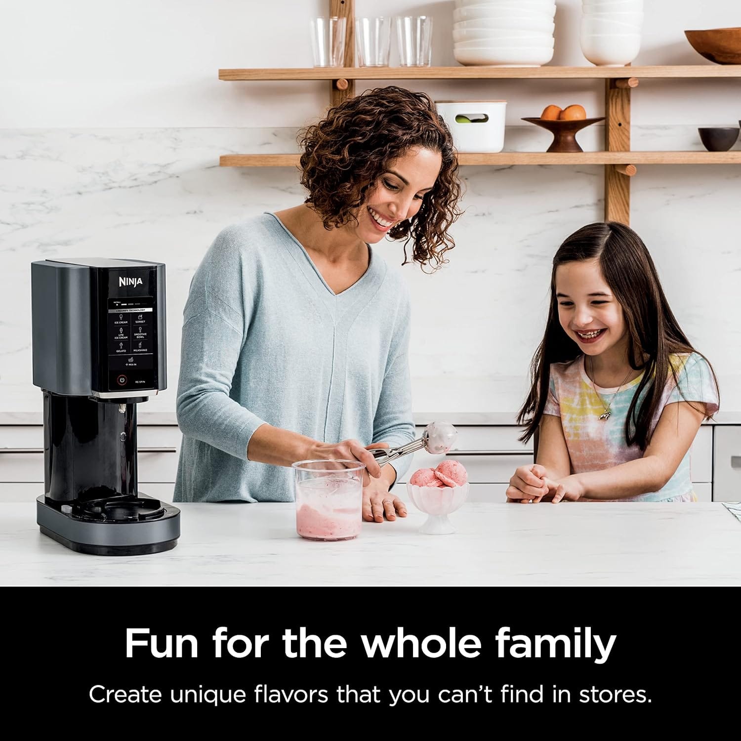 mother and daughter making ice cream with ice cream maker